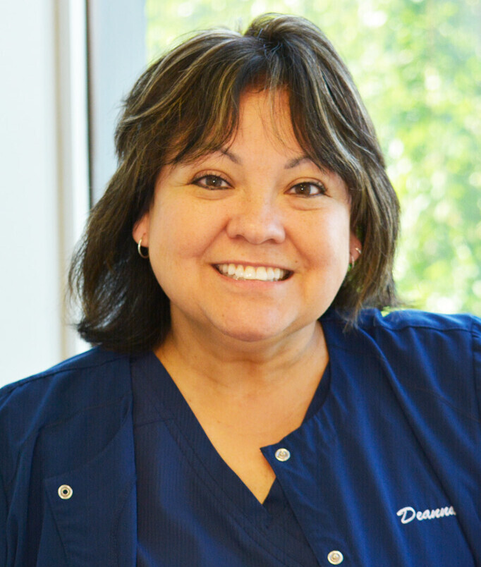 CLOSE UP PHOTO OF CLINICAL STAFF WOMAN