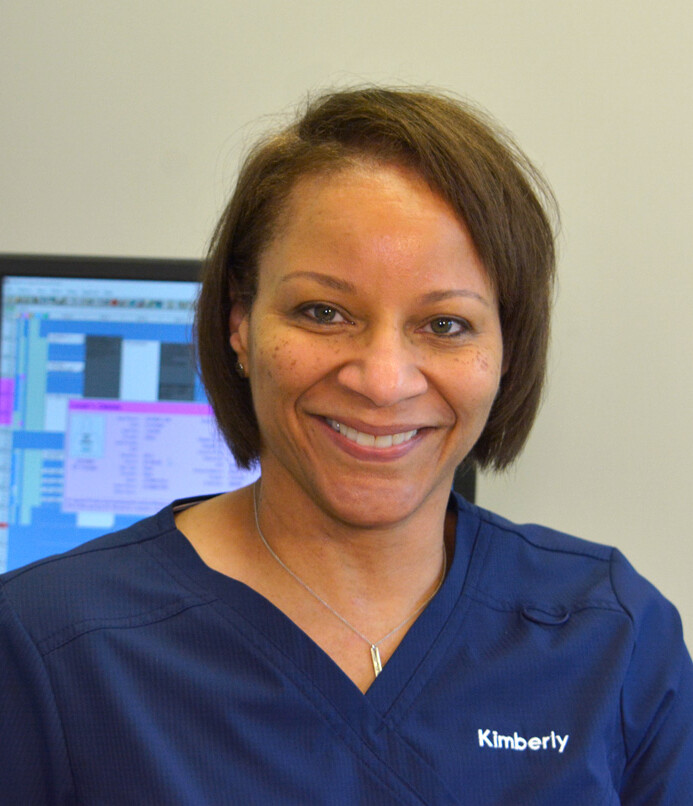 Photo of smiling woman clinical staff member